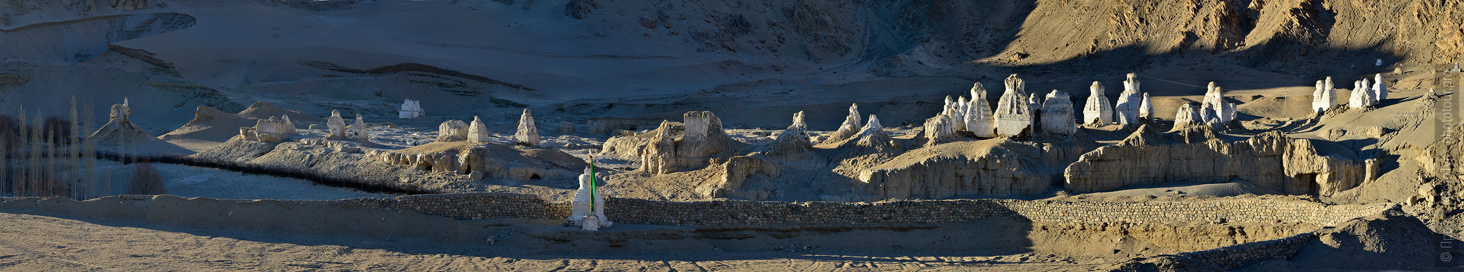 White stupas of Naropa. Tour Tibet Lakeside Advertising: Alpine lakes, geyser valley, Lamayuru, Colored Mountains, 01 - 10.09. 2023 year.